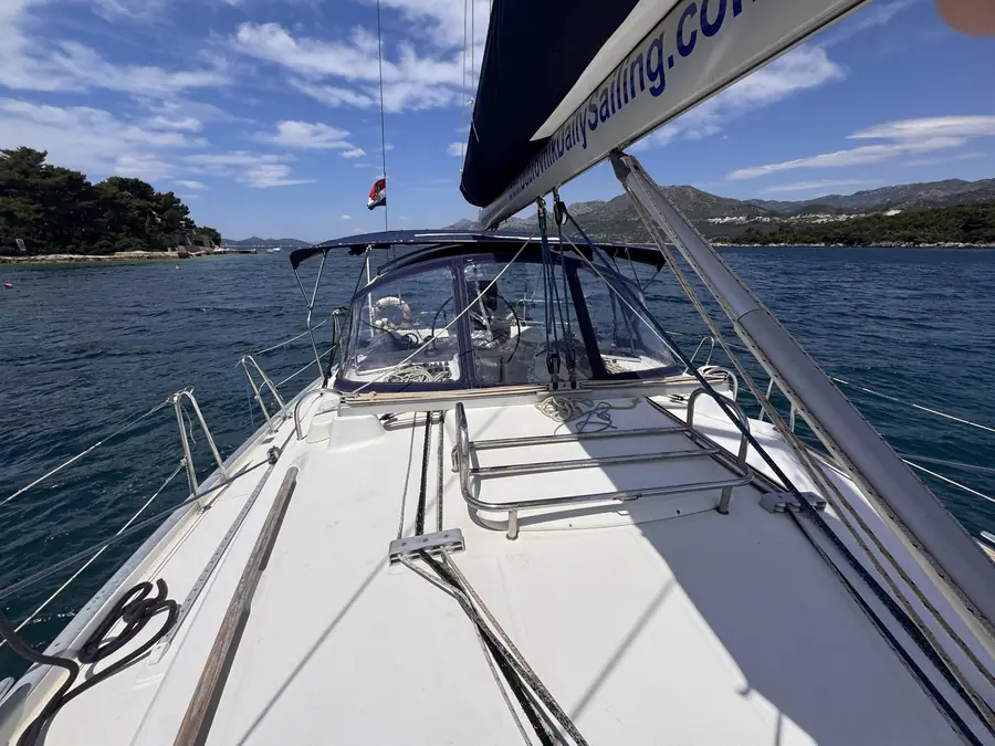 View along the deck of the sailing yacht toward the bow and the sea